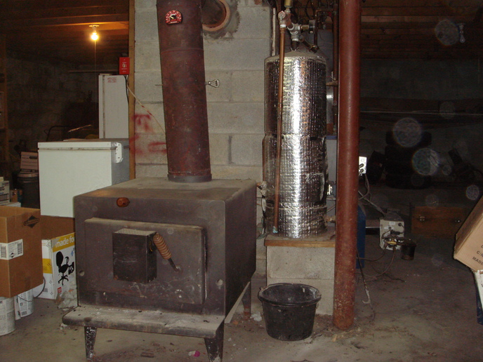 The blue and white by the bottom of the red pole is the Utica oil boiler.