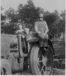 15-30 Mccormick Deering - Picture was made around 1945.  The older man is my grandfather and the 3 youngsters are some of his grandchildren.<P>The tractor was used to run a sawmill, a feedmill and also to pull a disk plow.  Dad used to say it took an acre of land to turn it around if you were in plowed dirt.  I think the 15-30 meant it had 15 drawbar HP and 30 on the belt.